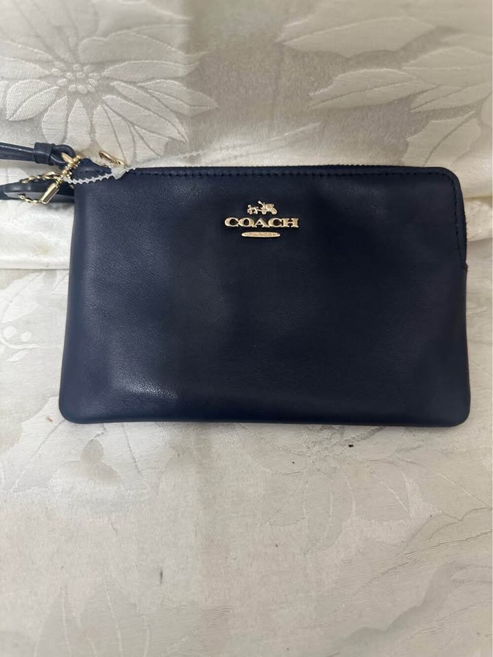 New Coach navy leather wristlet. B-304